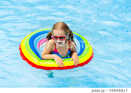 Child in swimming pool on toy ring. Kids swim. Child in swimming pool on toy ring. Kids swim. 50848817