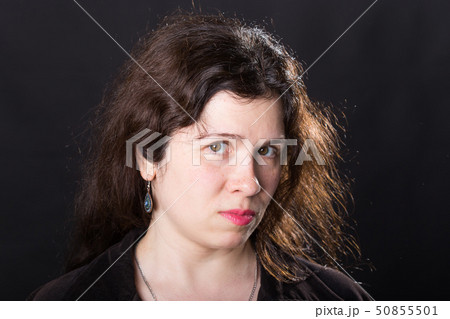 Portrait of a young woman. Emotions of sadness and depression. 50855501