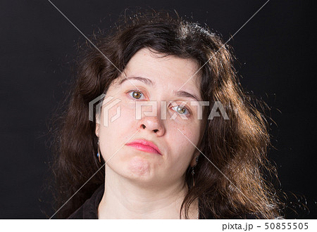 Portrait of a young woman. Emotions of sadness and depression. 50855505