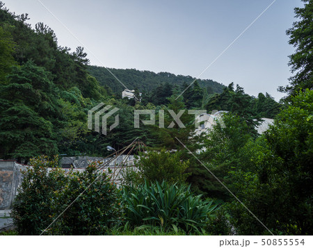 Old abandoned green park in front of the mountain Old abandoned green park in front of the mountain 50855554