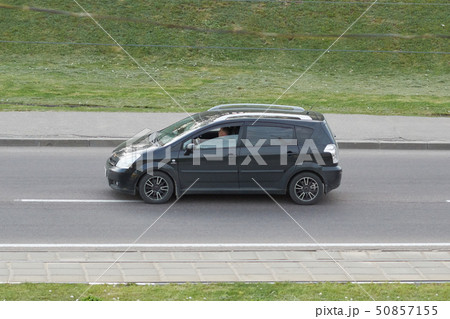 Passenger car black in the city 50857155