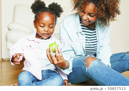 adorable sweet young afro-american mother with cute little girl, lifestyle people concept, happy 50857513