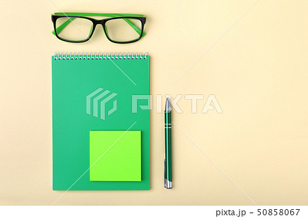 Business accessories on desktop: notebook, diary, fountain pen, glasses. Macro with blur and soft 50858067