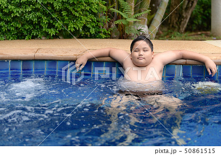 Obese boy relaxing enjoying hot tub Obese boy relaxing enjoying hot tub 50861515