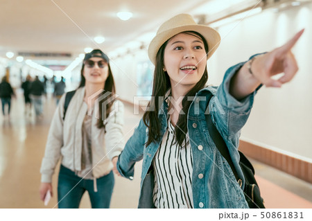 friends tourists in passageway excited pointing friends tourists in passageway excited pointing 50861831