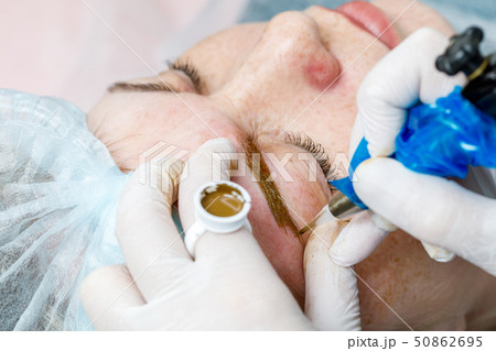 Permanent makeup, tattooing of eyebrows 50862695