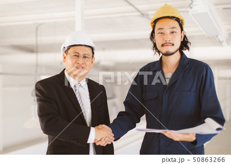 Asian engineer handshakes with executive engineer 50863266