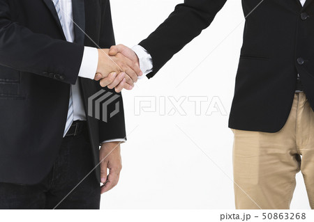 Businessmen handshake together.. 50863268