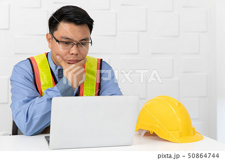 Asian man working Asian man working 50864744