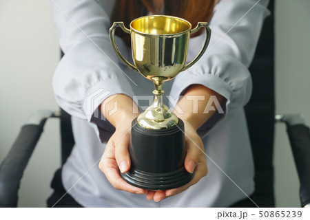 Business woman give trophy,win concept. Business woman give trophy,win concept. 50865239