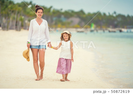Young mother and little daughter enjoying the beach in Dominican Republic 50872619