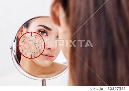 Red aim shows dry facial skin before moistening. Red aim shows dry facial skin before moistening. 50897545