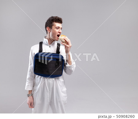 Young stylish male worker with chest rig bag is Young stylish male worker with chest rig bag is 50908260