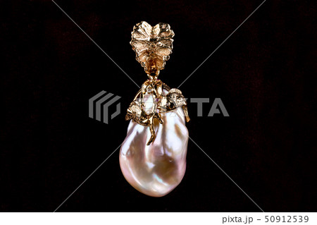 A pendant in a gold frame a pearls drop with two A pendant in a gold frame a pearls drop with two 50912539