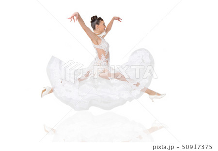 pretty smiling woman in wedding dress jump 50917375