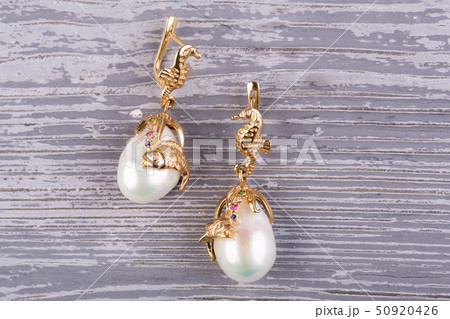Magnificent gold earrings in the form of graceful Magnificent gold earrings in the form of graceful 50920426