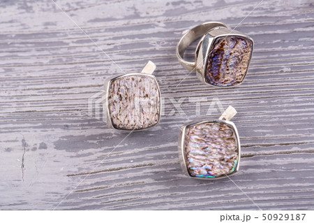 A set of earrings and a ring from a sink a helioye 50929187