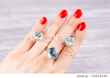 A ring and earrings with blue topaz in white gold A ring and earrings with blue topaz in white gold 50929189