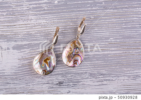 Nacreous earrings are executed from a natural sink Nacreous earrings are executed from a natural sink 50930928