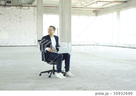 Young businessman with laptop in the big hall 50932690