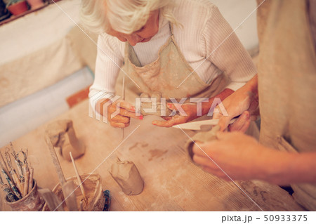 Top view of a positive senior woman looking at the bowl 50933375