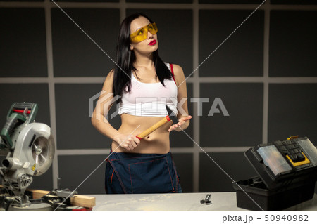 Women standing builder wearing white shirt worker 50940982