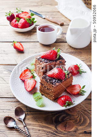 Chocolate truffle cake with strawberries and mint. Chocolate truffle cake with strawberries and mint. 50952066