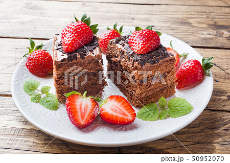 Chocolate truffle cake with strawberries and mint. Chocolate truffle cake with strawberries and mint. 50952070