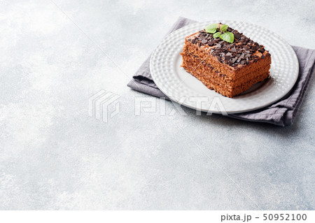 A piece of truffle cake with chocolate  50952100