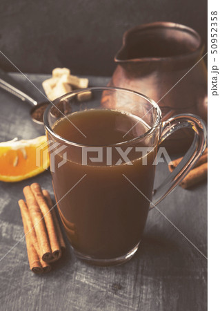 Autumn drink of coffee with orange juice on a dark Autumn drink of coffee with orange juice on a dark 50952358
