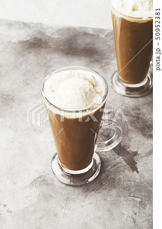 Ice coffee with ice cream on gray background. 50952381