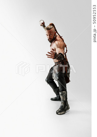 Man in leather viking's costume isolated on white studio background Man in leather viking's costume isolated on white studio background 50952553