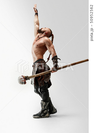 Man in leather viking's costume isolated on white studio background 50952562