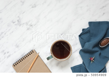Cup of coffee and notebook Cup of coffee and notebook 50954909