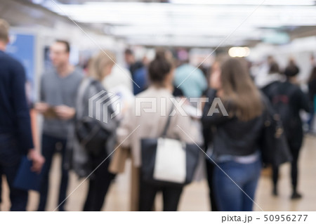 Blured image of businesspeople socializing and networking during coffee break at conference meeting. Blured image of businesspeople socializing and networking during coffee break at conference meeting. 50956277