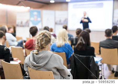 Business speaker giving a talk in conference hall. 50956295