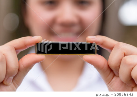 closeup girl hand holding blank label space closeup girl hand holding blank label space 50956342