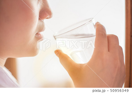 closeup girl drinking clean room temperature water 50956349
