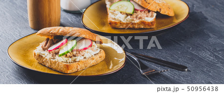 Delicious tuna sandwich, served with radish and Delicious tuna sandwich, served with radish and 50956438