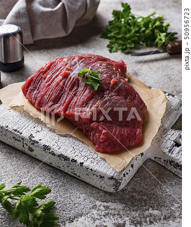 Raw meat on cutting board 50956723