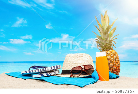 Beach accessories on sand Beach accessories on sand 50957357