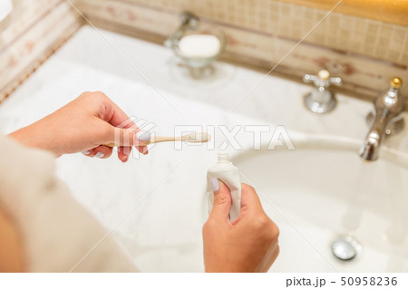 Cropped image of attractive woman hand applying Cropped image of attractive woman hand applying 50958236