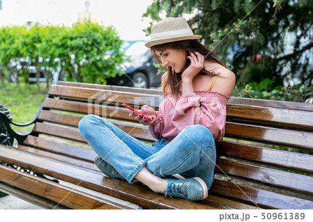 Fashionably dressed young woman on the street 50961389