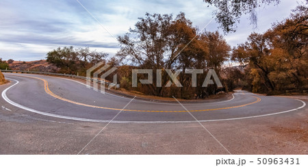 Winding road with trees and sky view in Fallbrook 50963431
