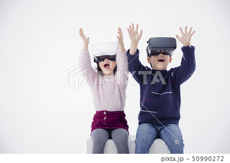 Cheerful boy and a girl on the white background 207 50990272