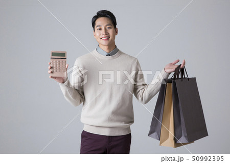 Attractive young man. sale, shopping, fashion, and style concept photo 157 Attractive young man. sale, shopping, fashion, and style concept photo 157 50992395