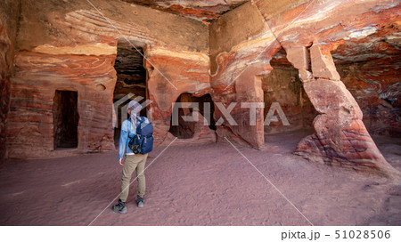 Asian man traveler in dwelling homes of Petra Asian man traveler in dwelling homes of Petra 51028506