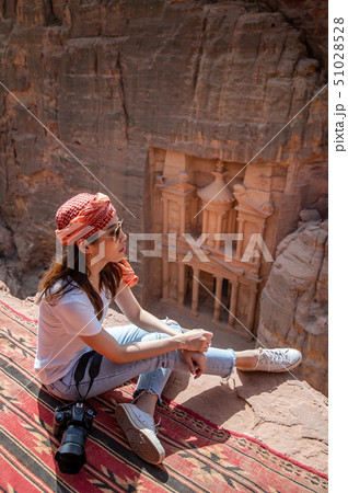 Asian woman traveler sitting in Petra, Jordan 51028528