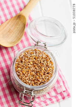 Dry bulgur wheat grains. 51038778