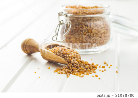 Dry bulgur wheat grains. Dry bulgur wheat grains. 51038780